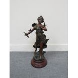 A French coloured spelter statue "Charmeuse" on plinth,