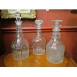 Three Georgian decanters with stoppers including cut glass examples