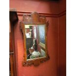 A 19th Century walnut shaped mirror, 80cm tall,