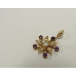 An Edwardian gold floral burst pendant set with pearls and amethysts