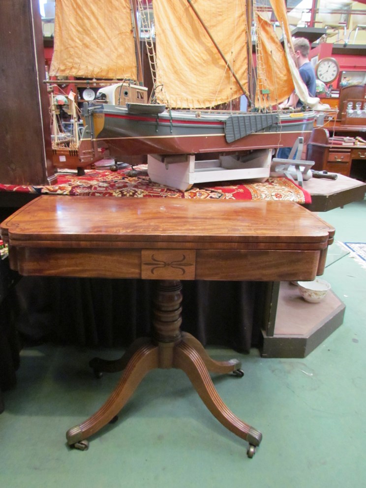 A 19th Century mahogany tea table of breakfront form,