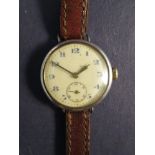 An early 20th Century silver lady's wristwatch with Arabic dial and subsidiary seconds,