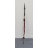 An African spear with leather covered shaft and scabbard