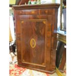 A 19th Century flamed mahogany corner cupboard, marquetry inlay with central "shell" motif,