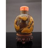An 18th Century Jasper Agate snuff bottle of fine large form carved with a relief of a bird,
