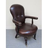 A circa 1840 mahogany and leather library chair, with brass stud decoration,