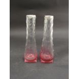 A pair of cranberry tinted glass vases,