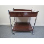 A 1970's chrome and formica two tier drinks trolley with pull-out warming tray