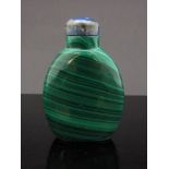 A Chinese malachite snuff bottle of plain form with lapis lazuli stopper, 6cm tall (nibble to foot).