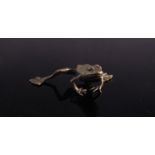 A miniature solid bronze frog,