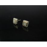 A pair of 9ct gold diamond set earrings of rounded square form