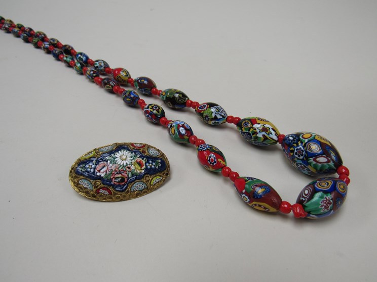 A micro mosaic oval brooch and a millefiori bead necklace