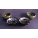 Four glazed pottery dishes one with oriental character mark to base, 6.