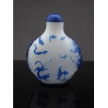 An 18th Century fine Chinese milk glass snuff bottle with a fine overlay of blue glass,