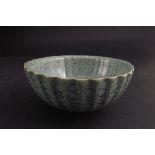 A crackle glaze celadon type fluted bowl with character mark to base,