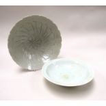 A Chinese Longquan Celadon bowl (18cm diameter) and a floral pattern Celadon bowl (22cm diameter)