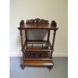 Circa 1840 a walnut three division Canterbury "Wot not" with decorative fret work the barley twist