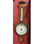 An Edwardian mahogany aneroid barometer with thermometer, with classical floral inlay.