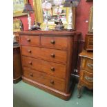 A Victorian mahogany two over three chest of drawers with central top, bun handles, plinth base,