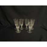 A set of six Victorian wine glasses with faceted bowl,