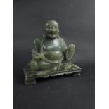 An Oriental hard stone Buddha