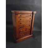 A table top yew wood chest of small proportions,