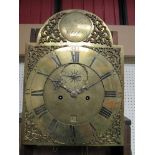 A Georgian oak longcase clock with arched brass dial,