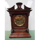An oak cased German mantel clock of architectural form with brass Roman dial and Lenzkirch 8 day