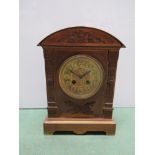 A brass classical design mantel clock, with key,