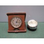 Two travel clocks and a miniature timepiece