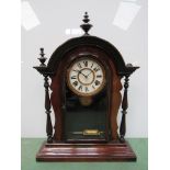 An American rosewood veneered "gingerbread" style mantel clock with Roman dial and 8 day movement,