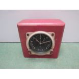 A WWII Spitfire dashboard chronograph clock on a mounted block,