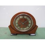 A walnut Art Deco period mantel clock, two train striking movement on a gong, key and pendulum,