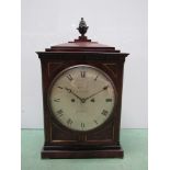 A Regency mahogany cased bracket clock with brass acorn finial, inlay, ring carry handles,