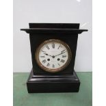 A large black marble mantel clock with Roman enamel dial a/f, 8-day movement, key and pendulum,