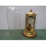 A Kundo anniversary clock with brass columns,