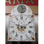 A late 18th Century oak longcase clock, the arch painted dial with harlequin figure to the top,