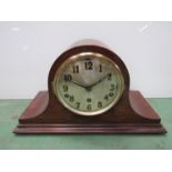 An oak Napoleon hat mantel clock, Arabic silvered dial with three train movement,