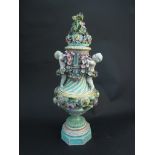 An antique "Meissen" porcelain vase and cover, flower encrusted with cherubs,