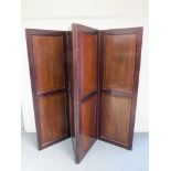 A Victorian mahogany panelled folding room divider made from four sections,