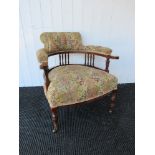 A Victorian tub chair with floral tapestry upholstery,