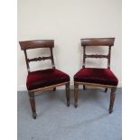 A set of eight William IV dining chairs with red velour seats,