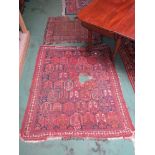 Two 20th Century worn Caucasus rugs with bold geometric design