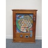 A 1940s/50s oak cased slot machine of horse racing theme by Wonders,