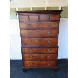 A George III mahogany chest on chest of eight drawers with ring drop handles,