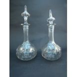 A pair of Victorian cut glass decanters with spire stoppers