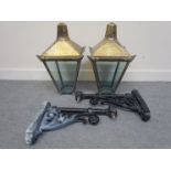 Two brass lanterns with brackets