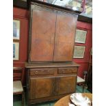 An 18th Century and later French chestnut full height cupboard with parquet front top over twin