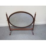 A late Victorian mahogany dressing table swing mirror oval form,