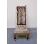A William IV rosewood open armchair with turned finials and fretwork decoration over barley twist